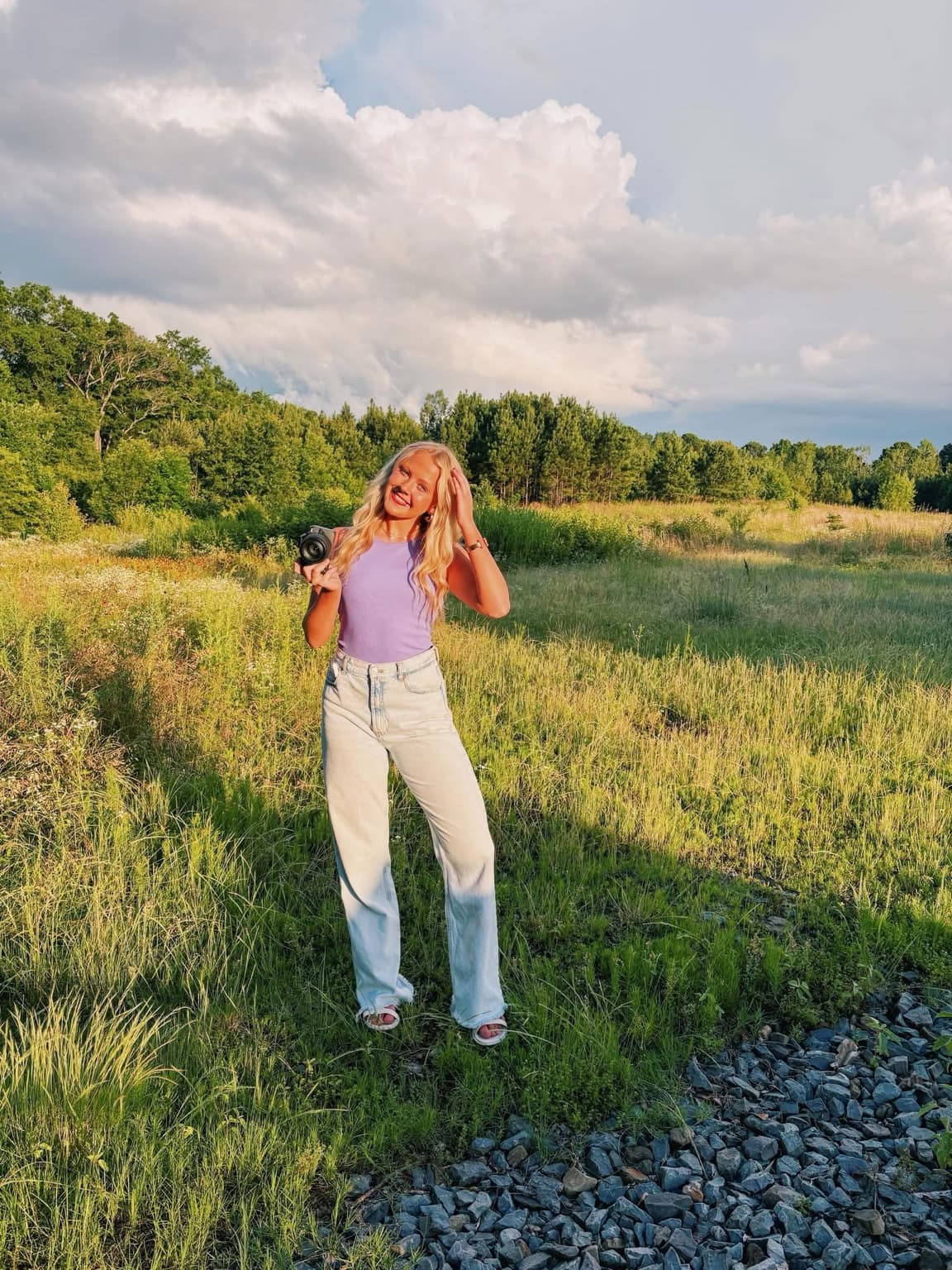 Gracie K photographing in the field in Central Arkansas