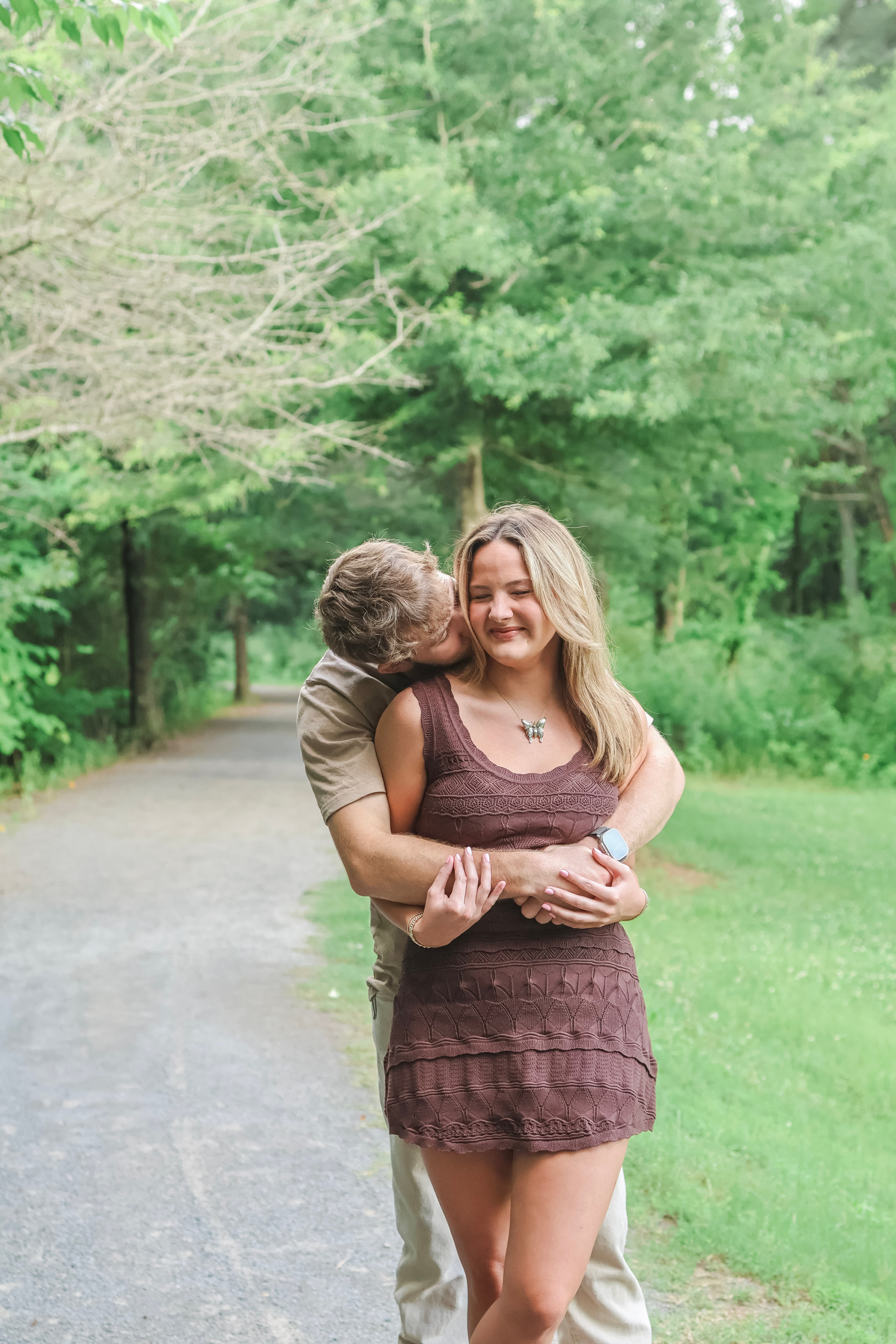 Couple sitting together outdoors in a natural portrait setting